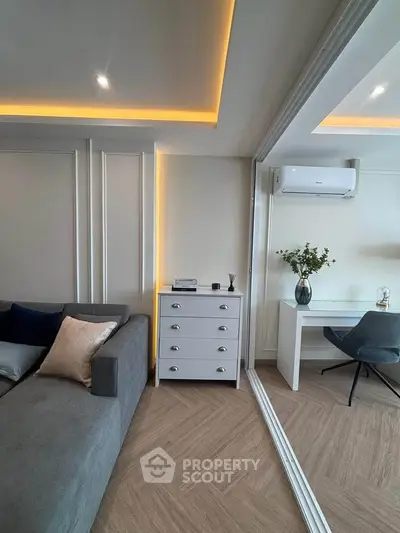 Modern living room with sleek furniture and elegant lighting