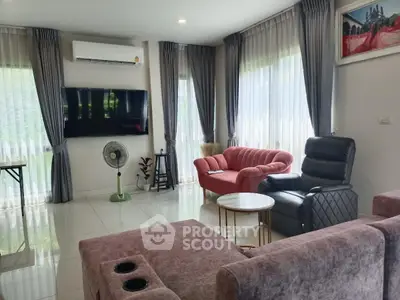 Spacious living room with modern furniture and large windows