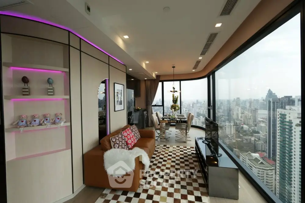 Luxurious high-rise living room with panoramic city view and modern decor.