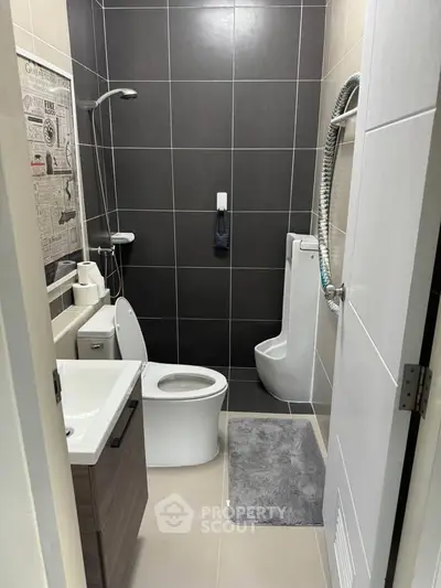 Modern bathroom with sleek fixtures and stylish tile design, perfect for contemporary living.