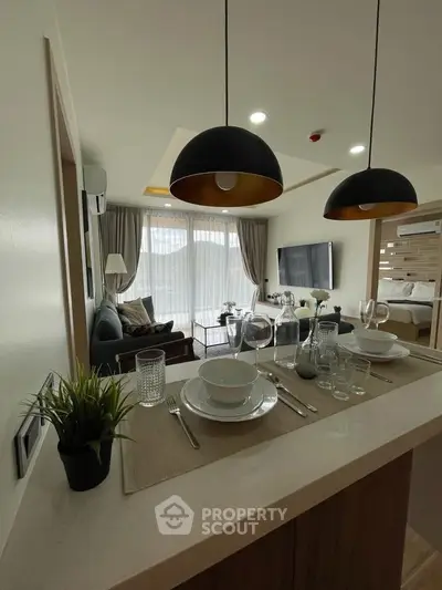 Modern open-plan living room with stylish decor and natural light