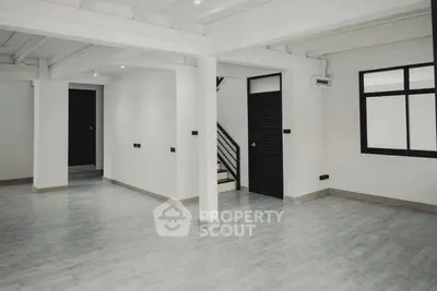 Spacious and modern open-plan living area with ample natural light, sleek flooring, and a versatile layout ideal for customization in a contemporary home.