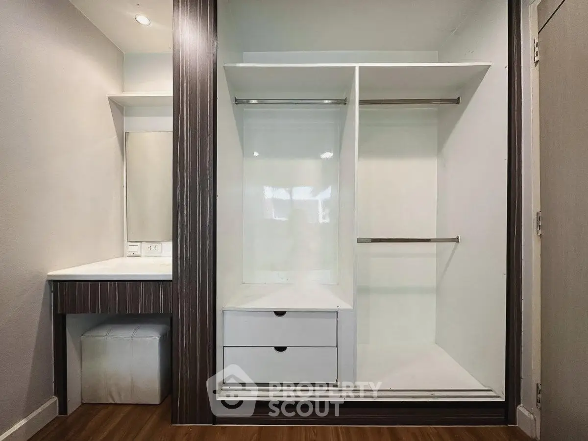 Spacious walk-in closet with modern design and ample storage space
