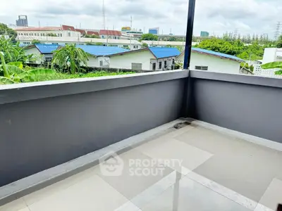 Spacious balcony with city view and modern tiled flooring
