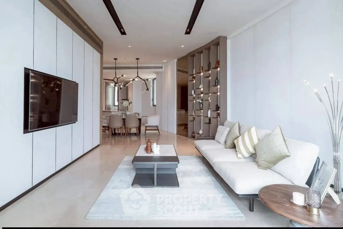 Luxurious modern living room with elegant decor and spacious seating area.