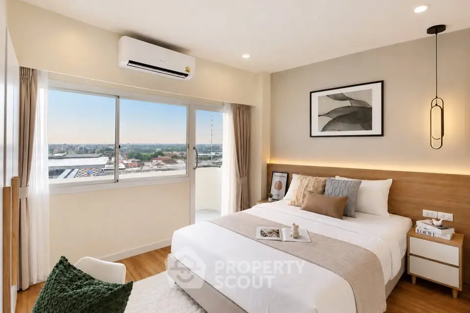 Modern bedroom with large window and stylish decor offering a stunning city view.