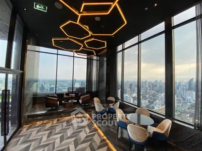 Luxurious high-rise lounge with panoramic city views and modern lighting