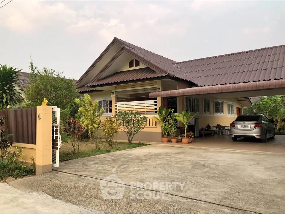 Charming single-story home with spacious driveway and lush garden, perfect for family living.