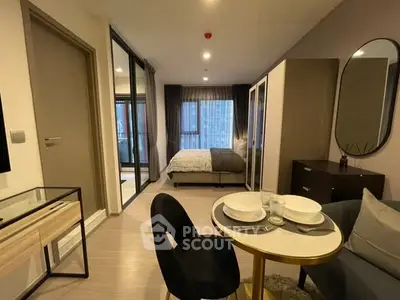 Modern studio apartment with stylish decor and cozy dining area