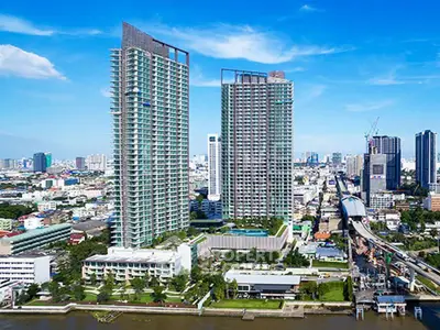 Stunning high-rise buildings with panoramic city views and riverside location, ideal for urban living.