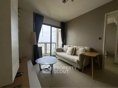 Modern living room with city view, cozy sofa, and stylish decor