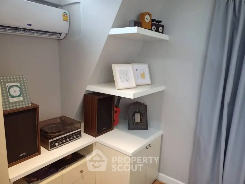 Cozy study nook with shelves and air conditioning in modern home