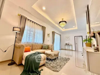 Luxurious living room with elegant chandelier and plush sofa in modern home