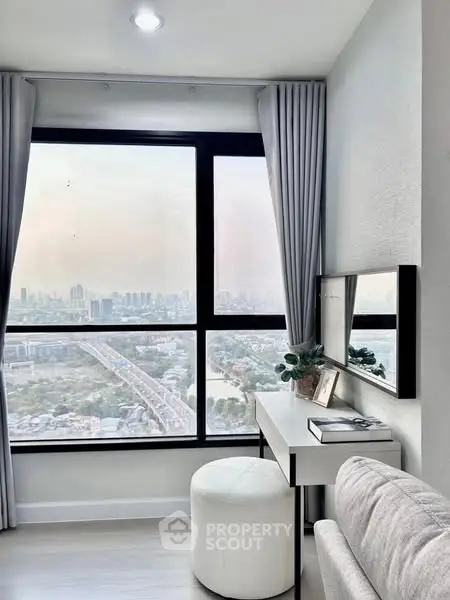 Modern high-rise apartment with stunning city view and elegant interior design.