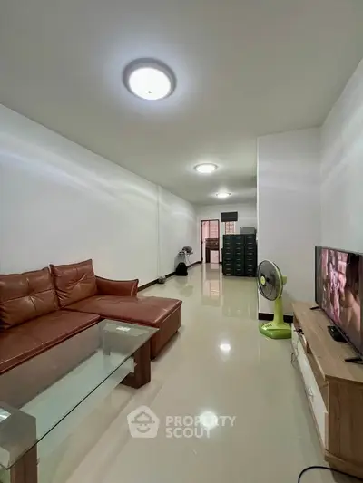 Spacious living room with modern furniture and sleek design