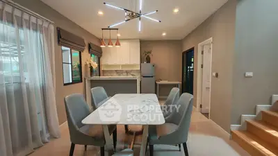 Modern dining area with elegant marble table and stylish lighting