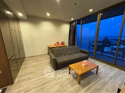 Modern living room with stunning city view and cozy furnishings