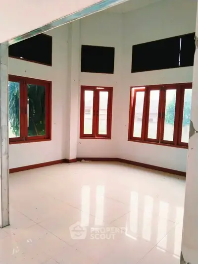 Spacious corner unit with large windows and natural light in modern home.