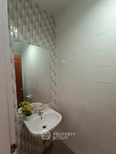Modern bathroom with stylish tiles and sleek sink design