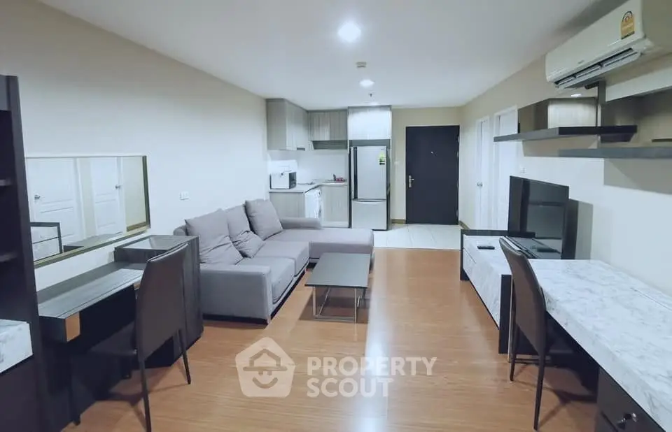 Spacious modern living room with open kitchen in stylish apartment