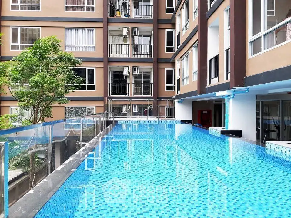 Luxurious apartment complex with a stunning rooftop pool and modern design.