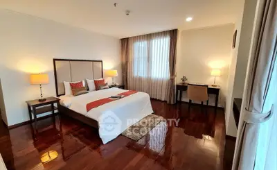 Luxurious bedroom with elegant decor and polished wooden floors