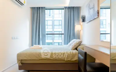 Modern bedroom with large window and stylish decor in urban apartment