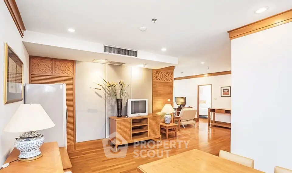 Spacious living room with elegant wooden furniture and modern decor