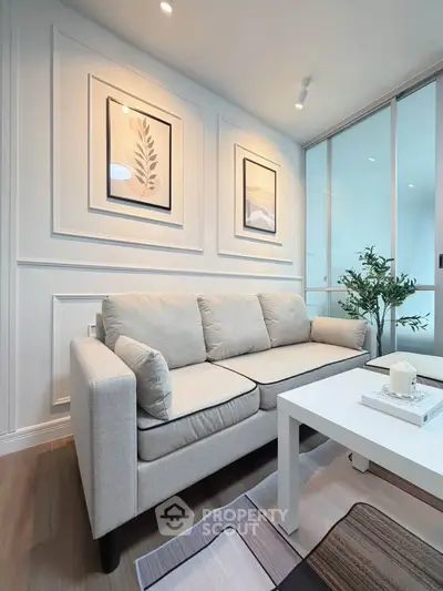 Modern living room with stylish decor and cozy beige sofa