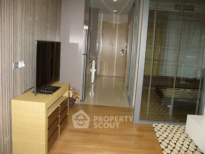 Modern apartment interior with sleek TV setup and stylish flooring