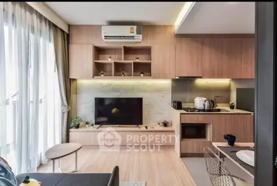 Modern living room with stylish wooden cabinetry and sleek TV setup