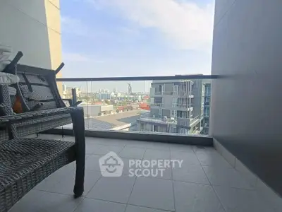 Spacious balcony with stunning city view, perfect for relaxation and enjoying the skyline.