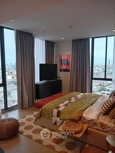Stylish bedroom with panoramic city views and modern decor
