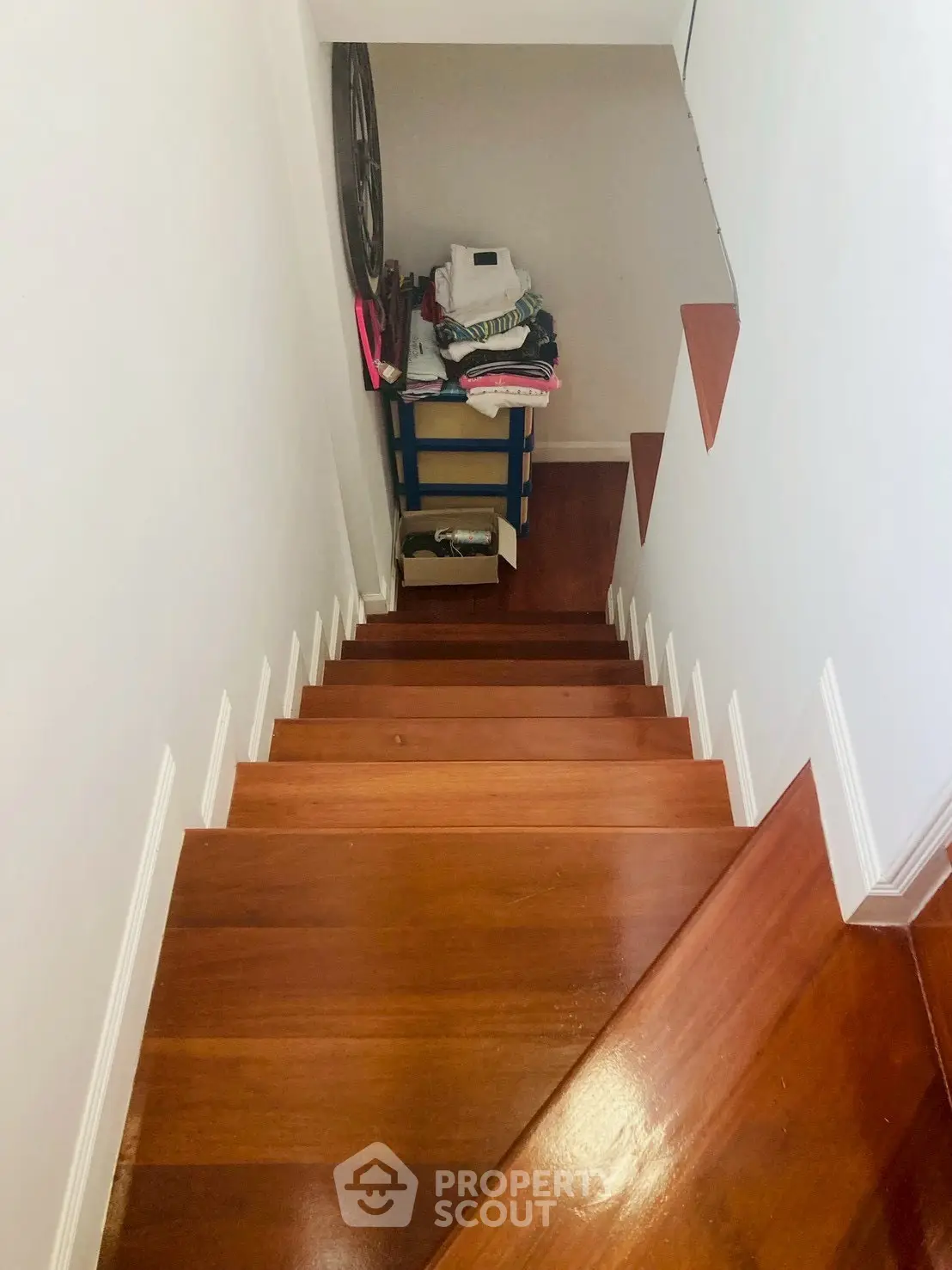 Elegant wooden staircase with storage space, perfect for maximizing home organization.