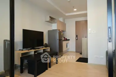 Modern apartment interior with sleek kitchen and cozy living area