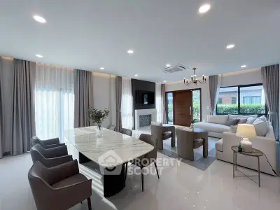 Spacious modern living room with elegant dining area and natural light