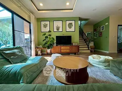 Spacious living room with modern decor and large windows for natural light.