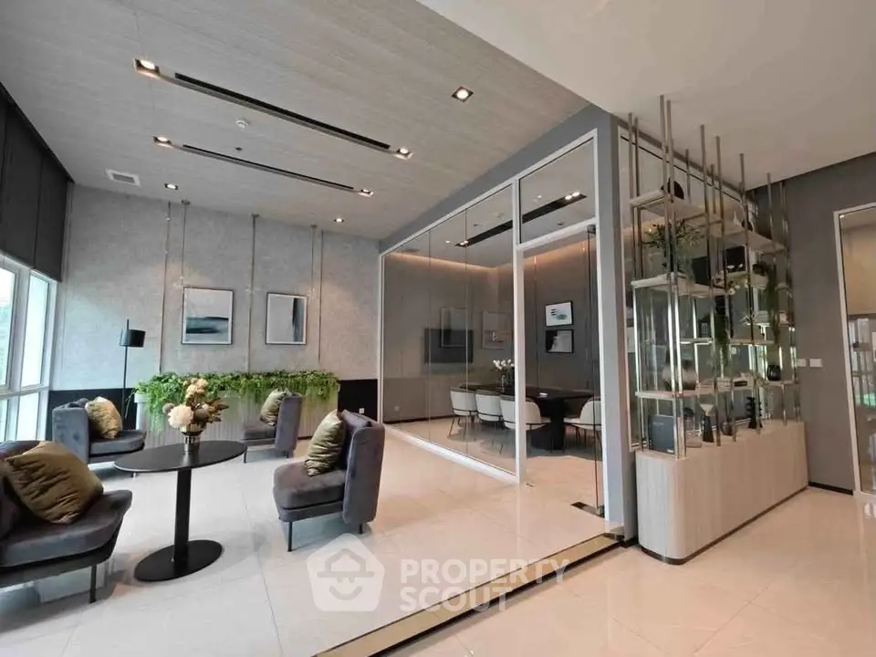 Modern living room with elegant decor and glass partitioned dining area