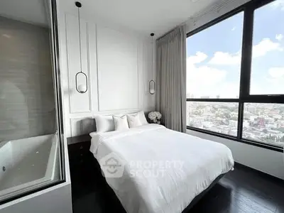 Luxurious bedroom with stunning city view and elegant decor