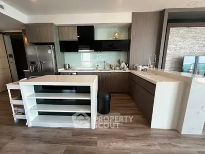 Modern kitchen with sleek cabinetry and open layout in a stylish apartment.