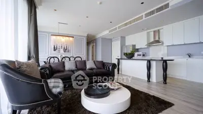 Luxurious open-plan living room with modern kitchen and elegant decor