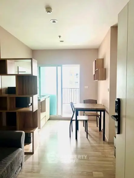 Bright and modern apartment interior with open layout and balcony access, perfect for urban living.
