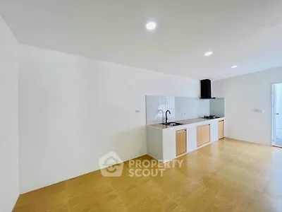 Spacious modern kitchen with sleek design and ample natural light