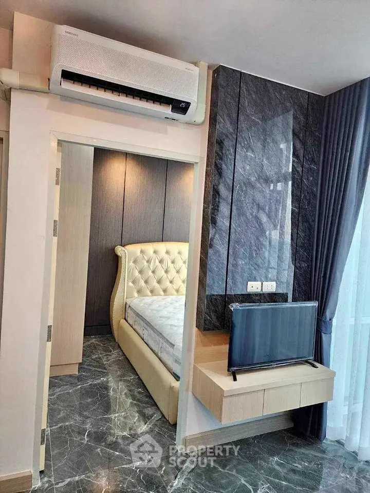 Luxurious bedroom with marble flooring and modern decor