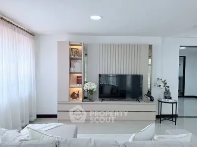 Modern living room with sleek TV unit and elegant decor