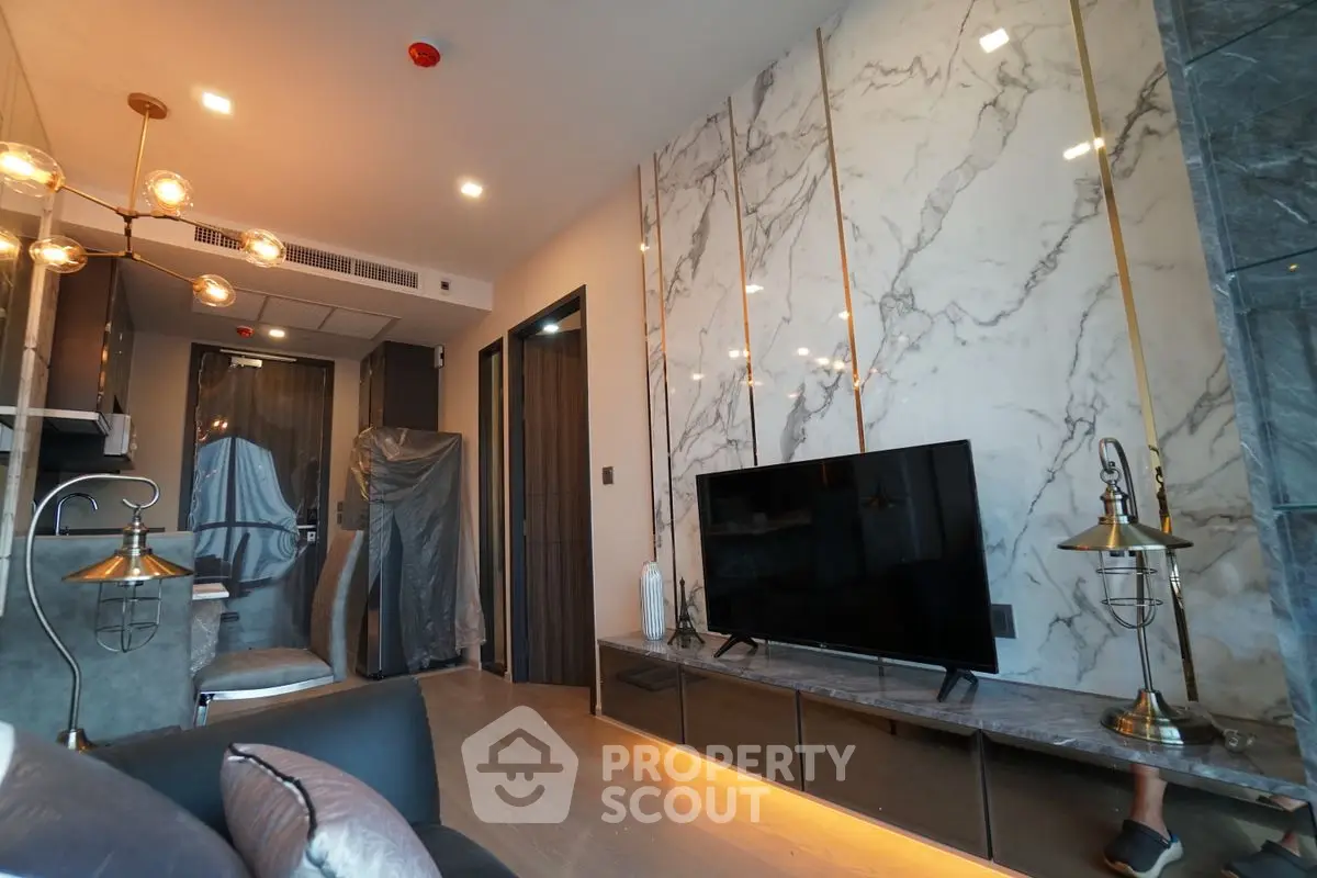 Luxurious modern living room with marble accent wall and stylish lighting