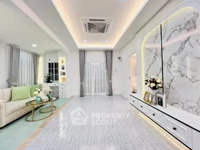 Elegant living room with marble accent wall and modern decor