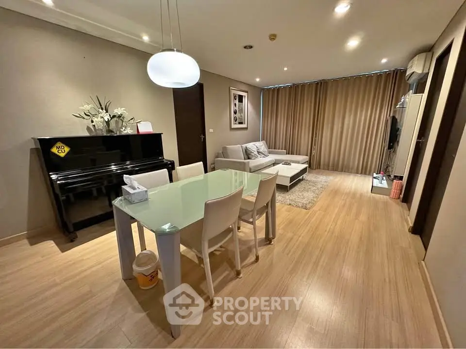 Spacious modern living room with elegant dining area and stylish decor