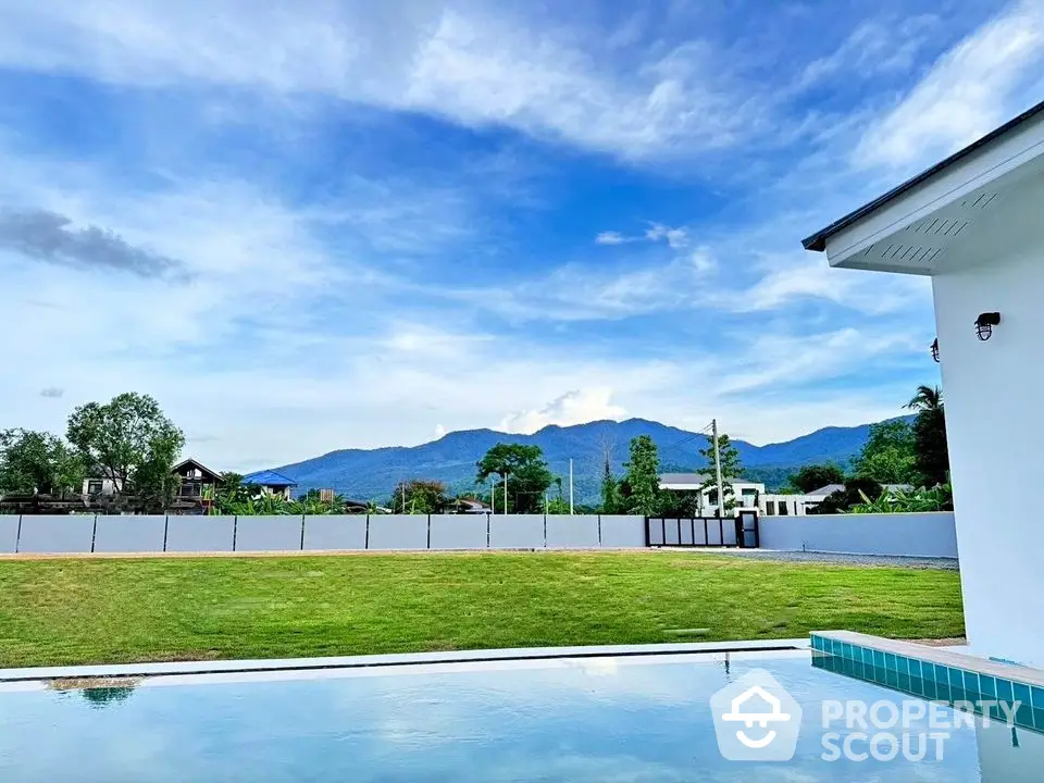 Stunning mountain view from modern home with private pool and spacious garden.