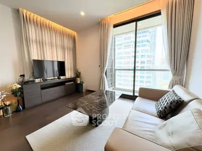 Modern living room with large window and city view, featuring sleek furniture and elegant decor.